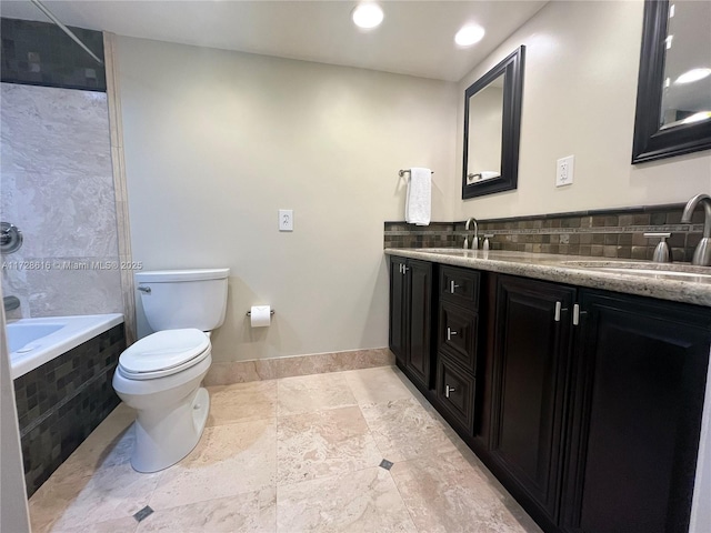 bathroom with toilet, a relaxing tiled tub, tasteful backsplash, and vanity