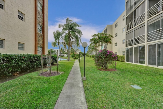 view of community featuring a yard