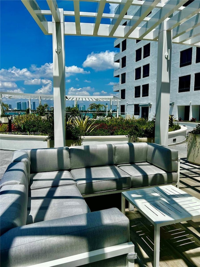 view of patio / terrace featuring an outdoor living space and a pergola