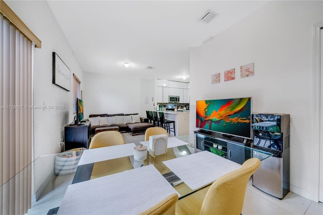 dining room featuring light tile patterned floors