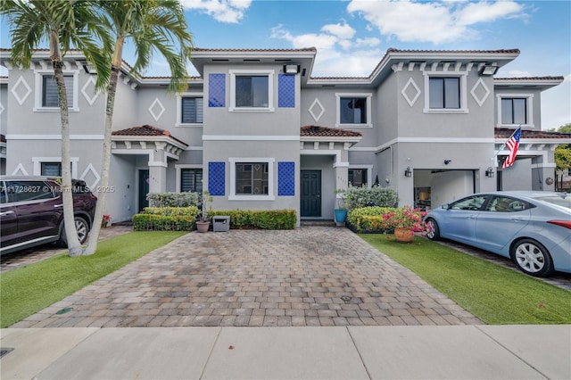 mediterranean / spanish-style house with a front lawn