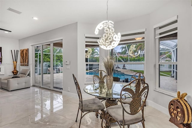 dining area with a notable chandelier