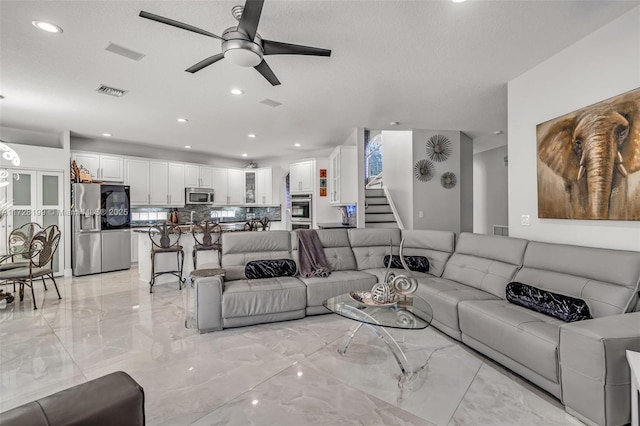 living room with ceiling fan