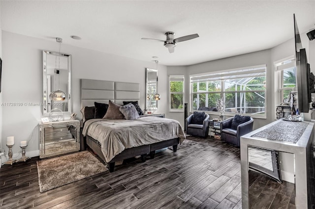 bedroom with ceiling fan and multiple windows