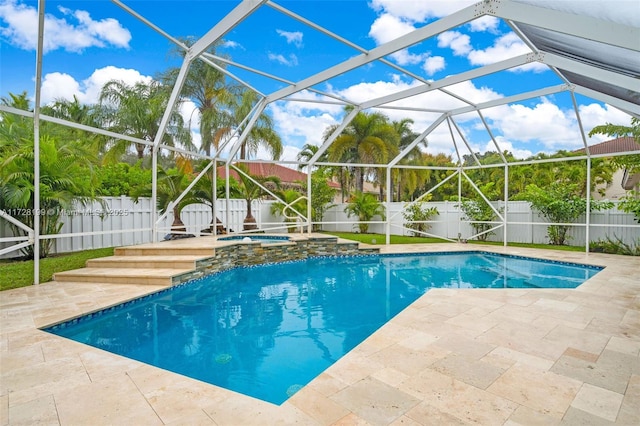 view of swimming pool featuring an in ground hot tub, a patio area, and glass enclosure