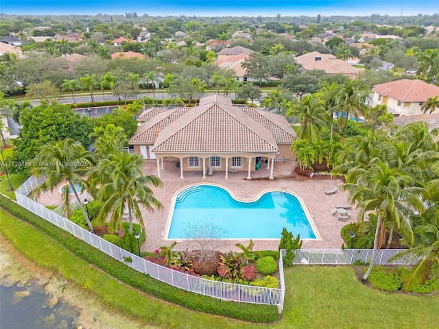 view of swimming pool featuring a lawn and a patio