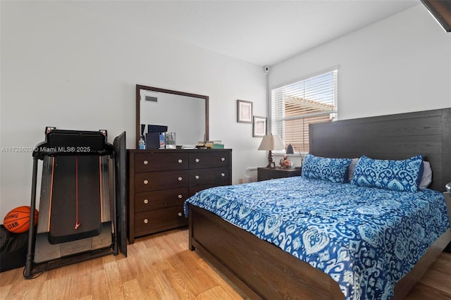 bedroom with light hardwood / wood-style floors