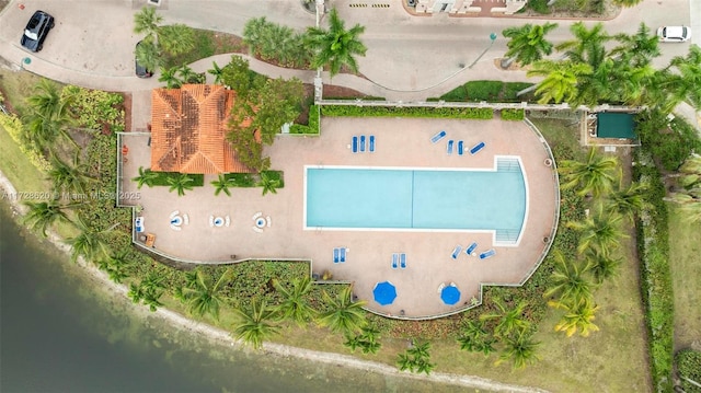 birds eye view of property with a water view