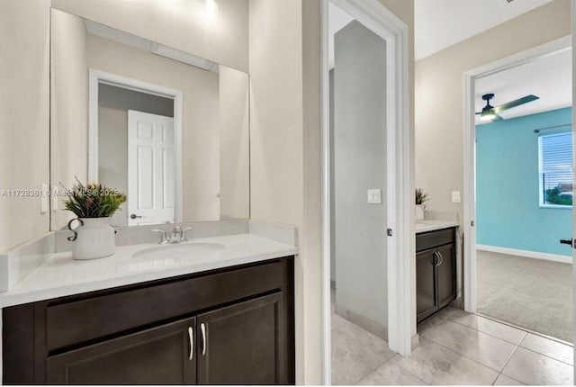 bathroom featuring ceiling fan, vanity, and tile patterned flooring