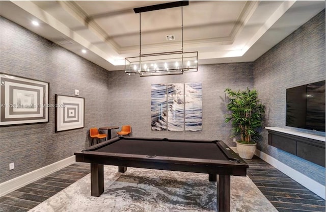 rec room with pool table, ornamental molding, and a raised ceiling