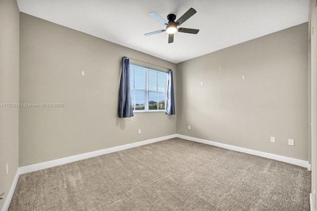 carpeted empty room featuring ceiling fan