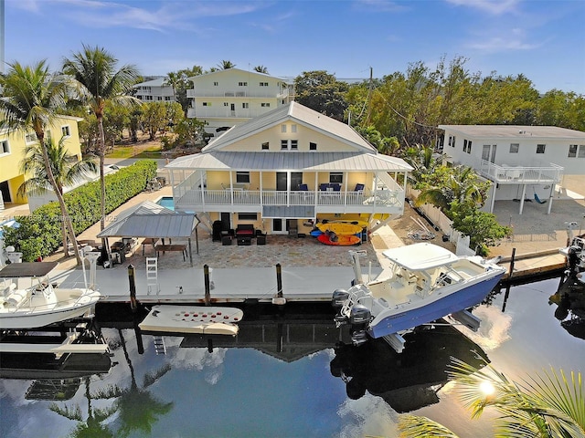 view of patio / terrace featuring outdoor dining space, a ceiling fan, fence, a fenced in pool, and stairs