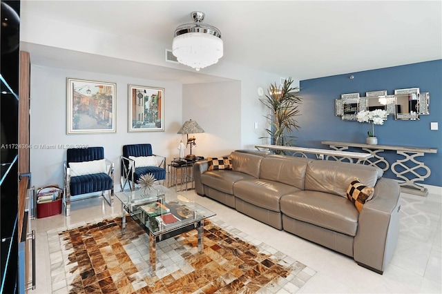 living room with visible vents and a notable chandelier