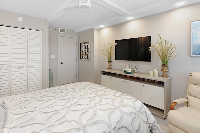 bedroom featuring visible vents and a closet