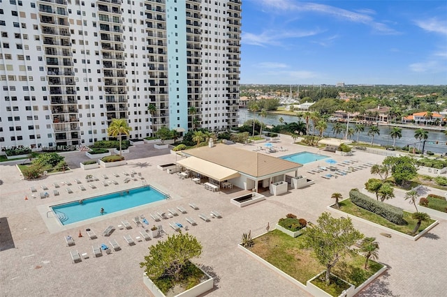 view of pool featuring a water view