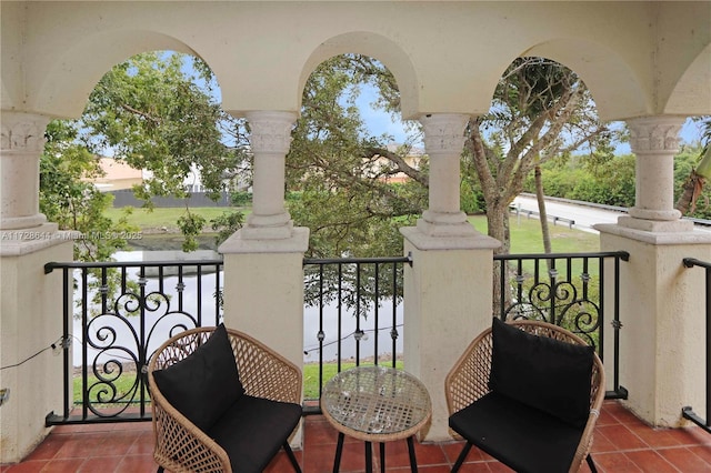 balcony featuring a water view