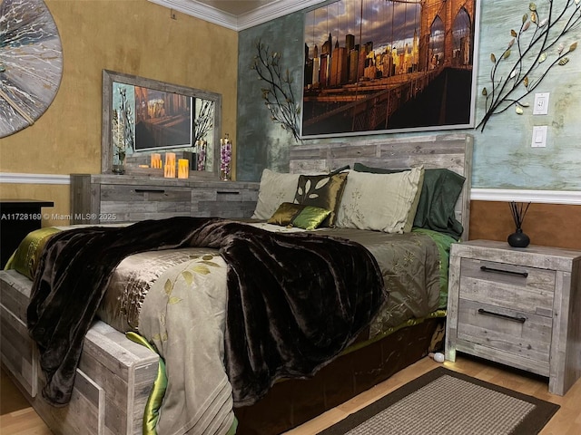 bedroom with ornamental molding and light wood-type flooring