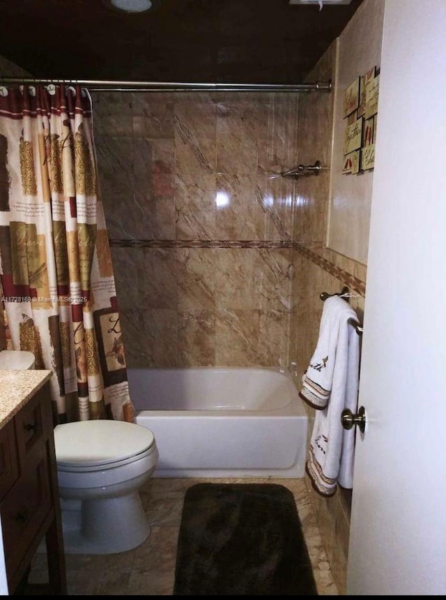 full bathroom featuring toilet, shower / tub combo, and vanity