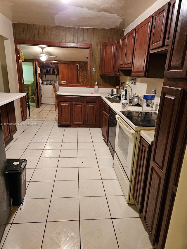 kitchen with ceiling fan, dishwasher, wooden walls, washer / dryer, and white electric stove