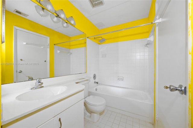 full bathroom with toilet, tile patterned flooring, tiled shower / bath, and vanity