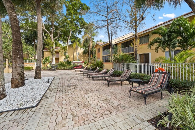 view of home's community with a patio area