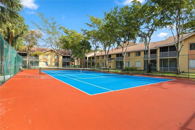 view of sport court with basketball hoop