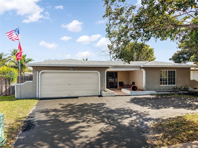 ranch-style house featuring a garage