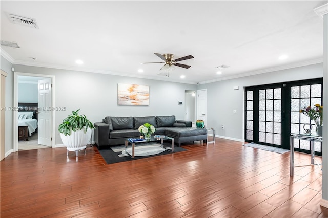 living room with ceiling fan, french doors, and ornamental molding