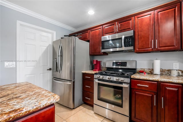 kitchen with light stone counters, crown molding, stainless steel appliances, and light tile patterned flooring