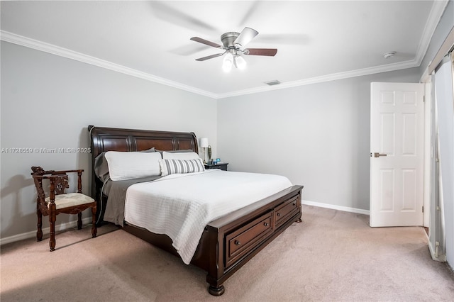 carpeted bedroom with ceiling fan and crown molding