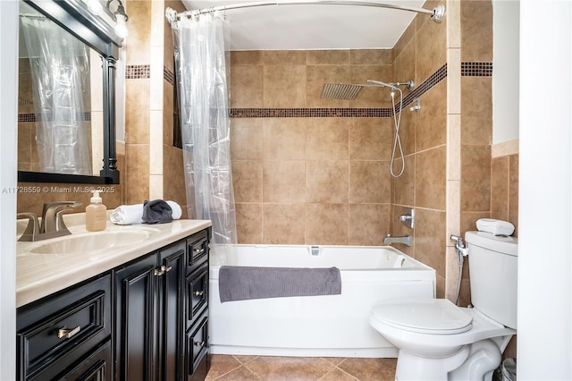 full bathroom with toilet, tile patterned flooring, tile walls, shower / bathtub combination with curtain, and vanity