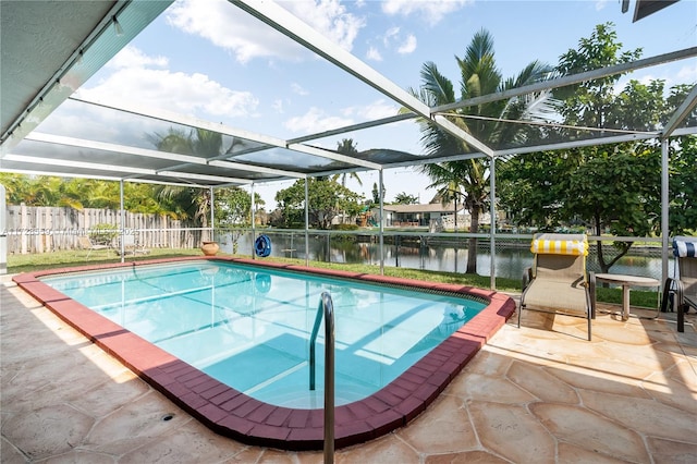 view of swimming pool featuring a lanai, a water view, and a patio