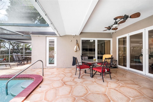 view of patio featuring ceiling fan, a lanai, and a swimming pool