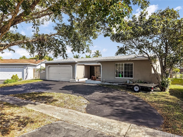 ranch-style house featuring a garage