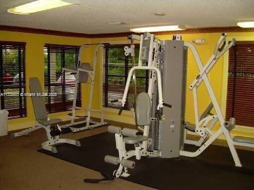 workout area featuring a textured ceiling