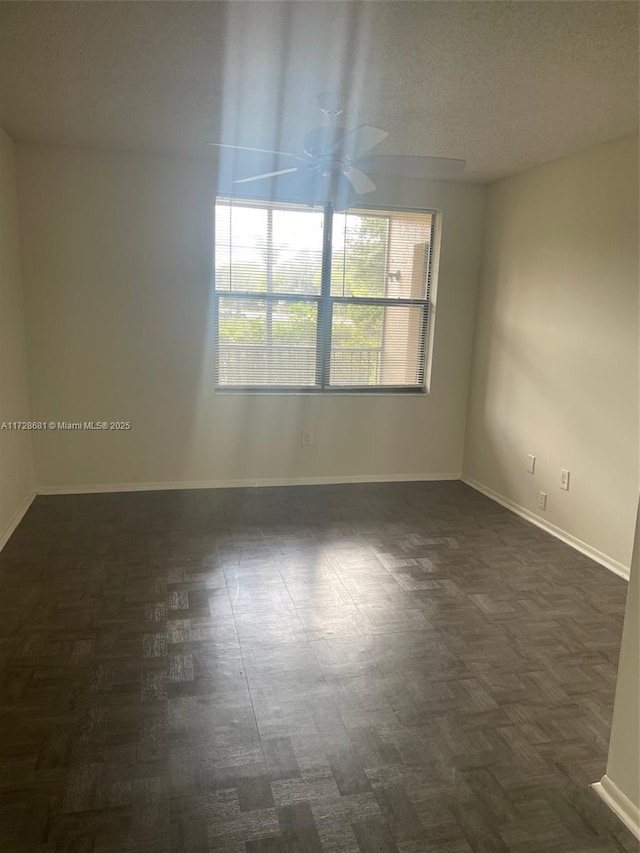 empty room featuring ceiling fan