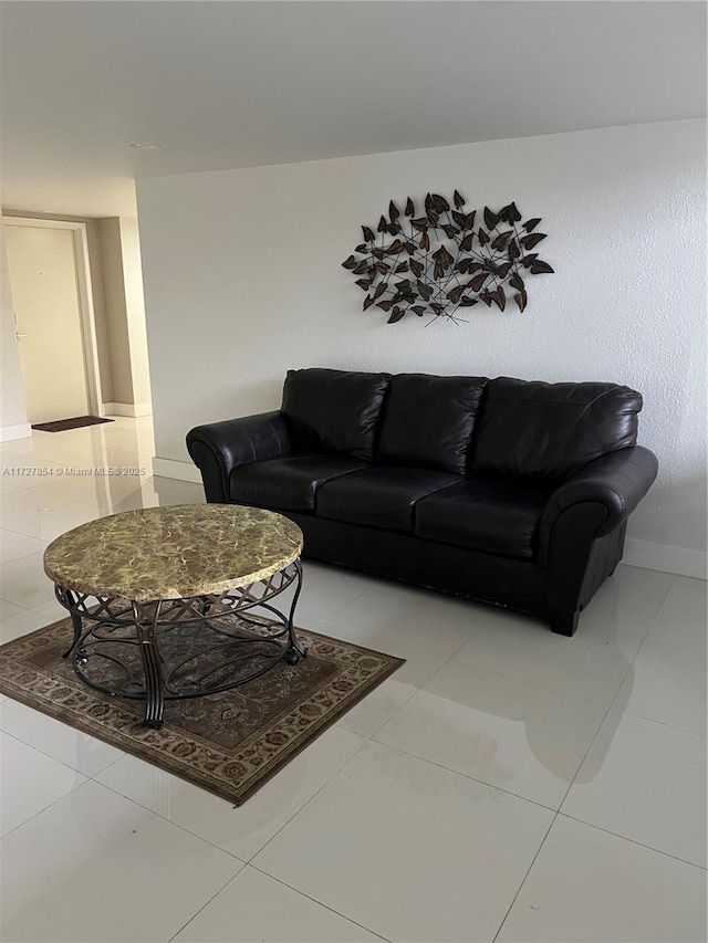 living room with tile patterned floors