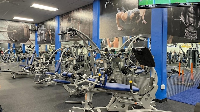 exercise room with a drop ceiling