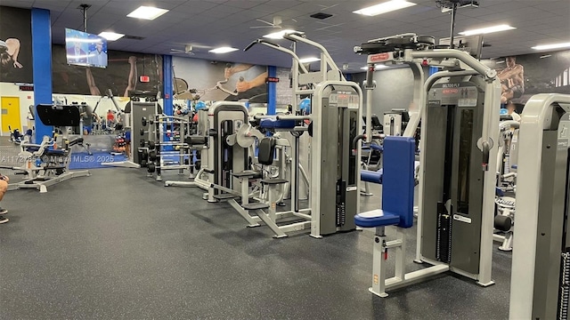 workout area with a drop ceiling