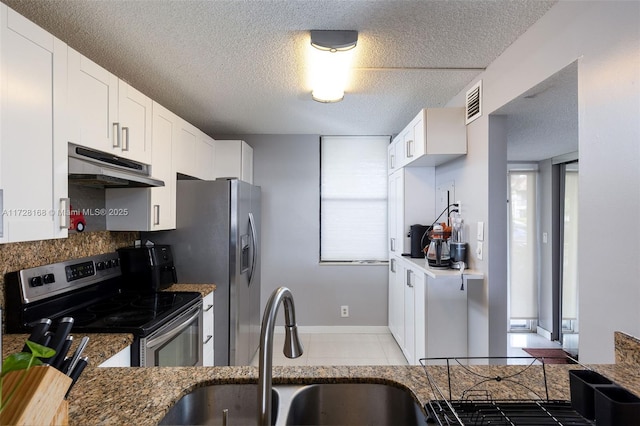 kitchen with white cabinetry, stainless steel electric stove, dark stone counters, a textured ceiling, and sink