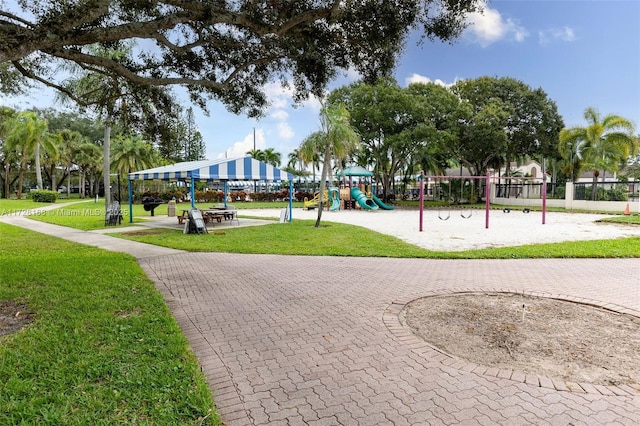 view of community with a playground and a lawn