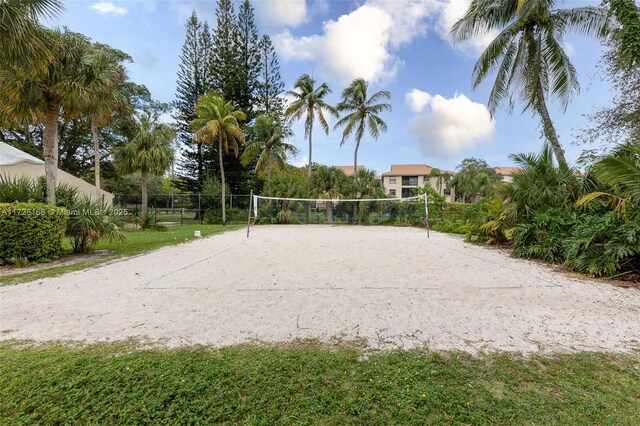 view of home's community featuring volleyball court and a yard