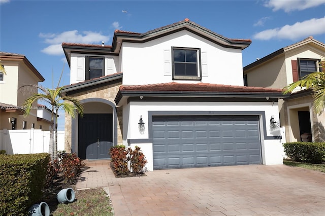 mediterranean / spanish-style house featuring a garage