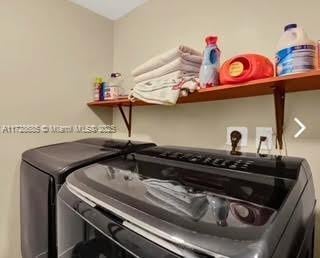 laundry room featuring separate washer and dryer