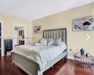 bedroom featuring dark hardwood / wood-style flooring