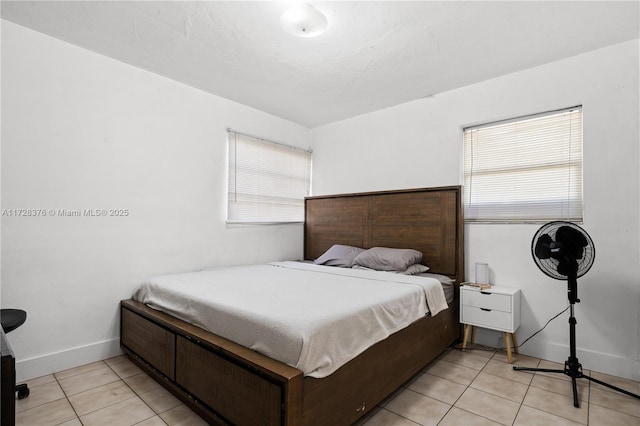 bedroom featuring light tile patterned flooring