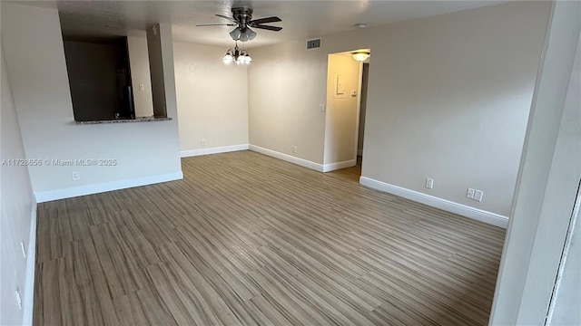 spare room featuring ceiling fan and light hardwood / wood-style floors