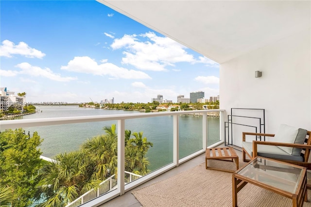 balcony featuring a water view