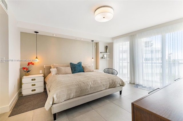 bedroom featuring light tile patterned flooring