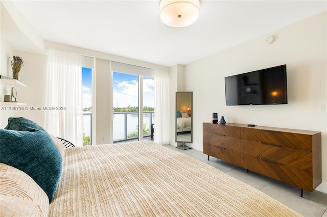 tiled bedroom featuring access to outside